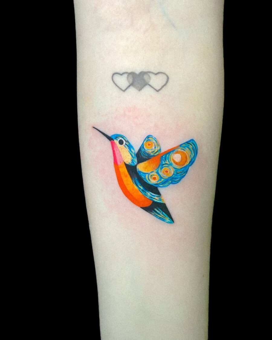 Vibrant hummingbird tattoo with colorful details Tattoo Design