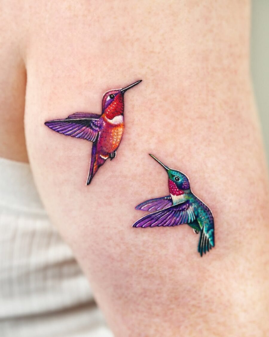 Vividly colored hummingbird tattoos on arm Tattoo Design