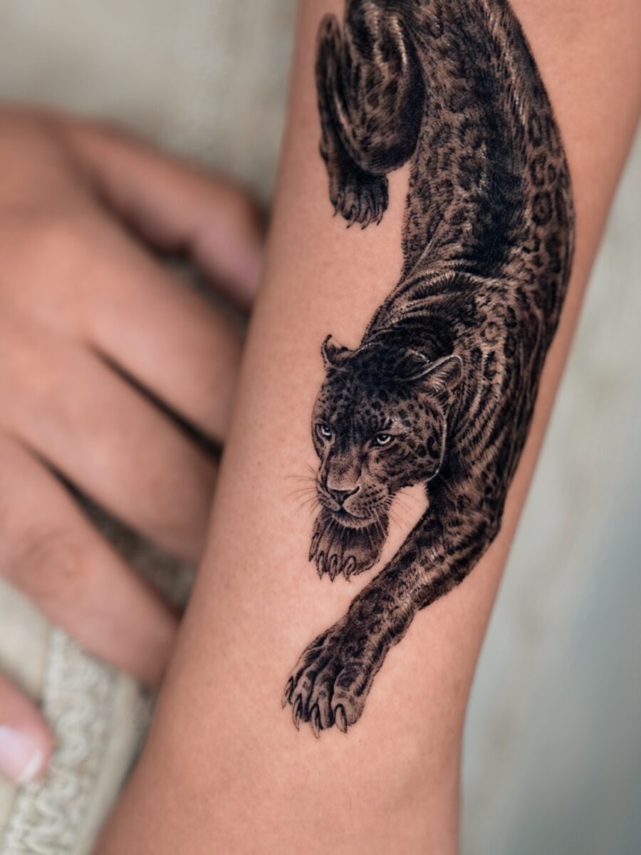 Striking hyper-realistic leopard tattoo design Tattoo Design