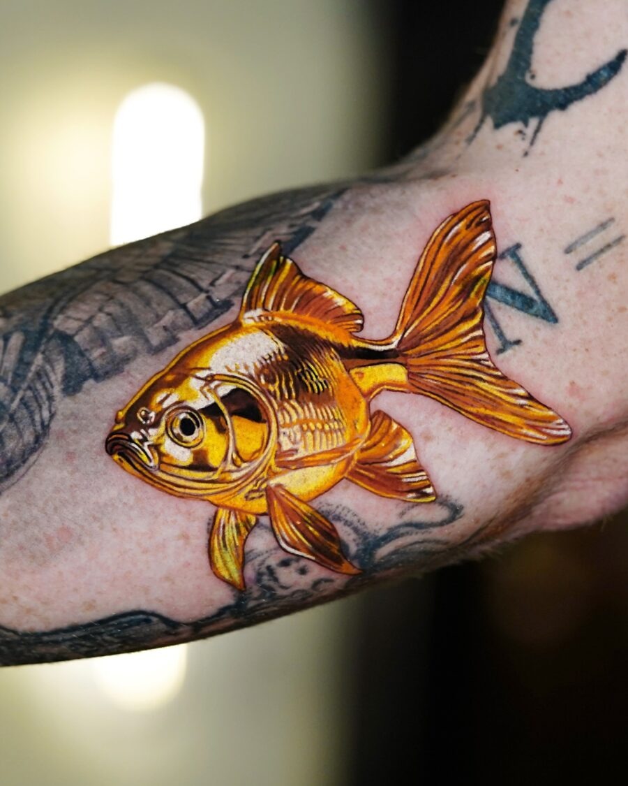 Stunning goldfish tattoo with vibrant detailing Tattoo Design
