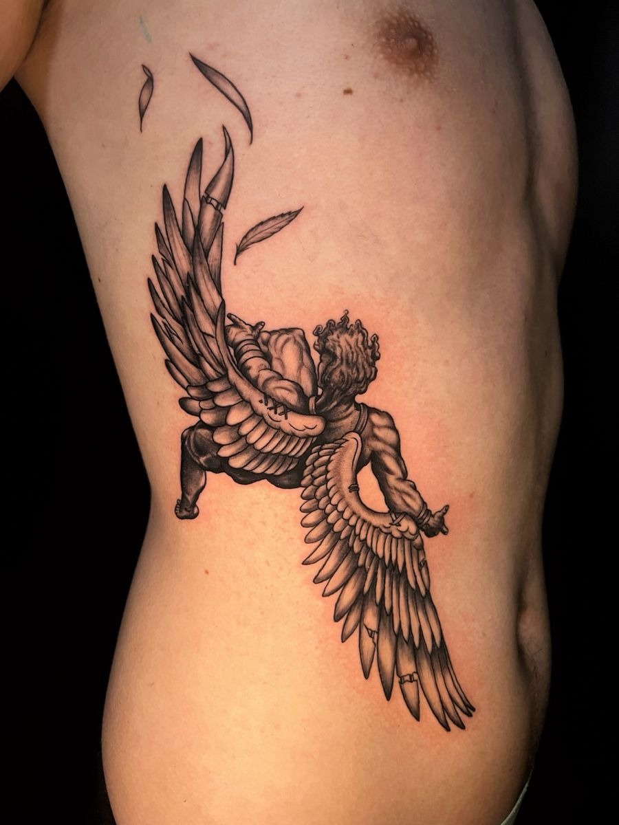 Rib Icarus With Broken Wings Tattoo Design