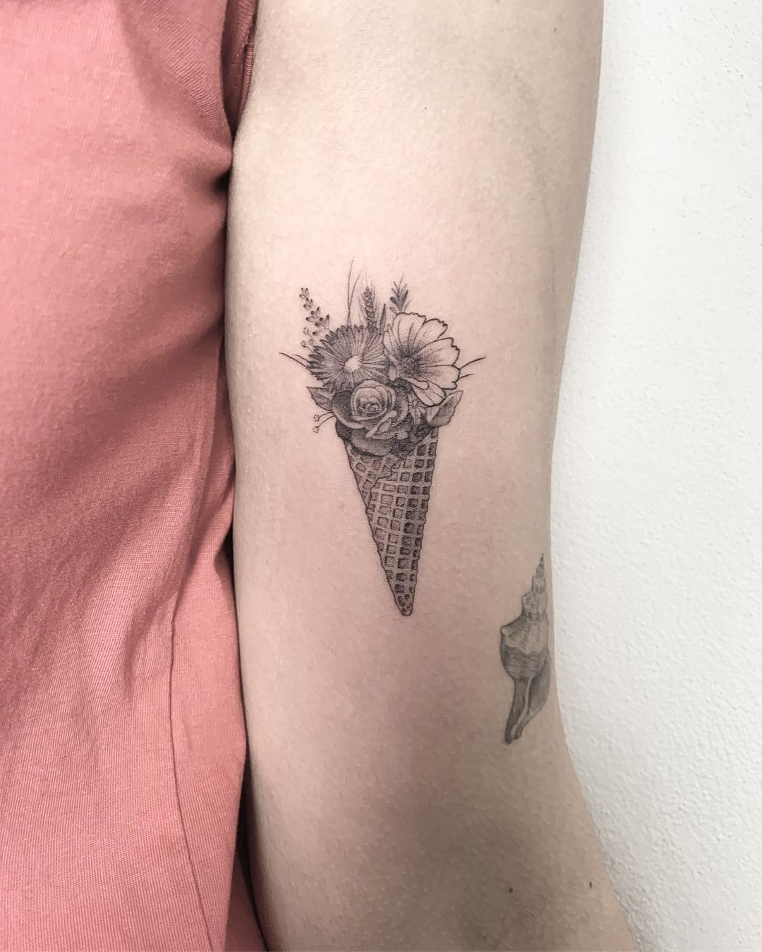 Floral cone tattoo with intricate detailing Tattoo Design