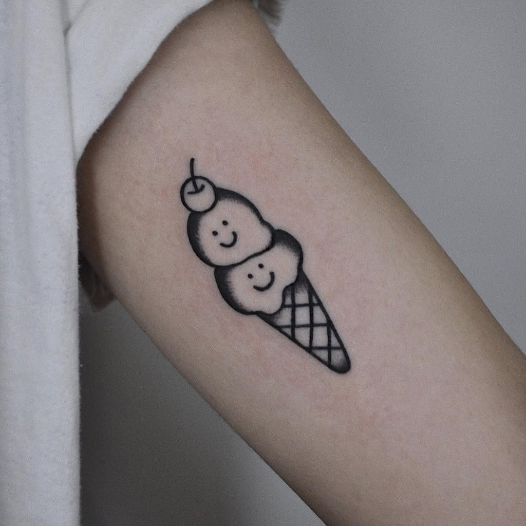 Whimsical ice cream cone with smiley faces Tattoo Design