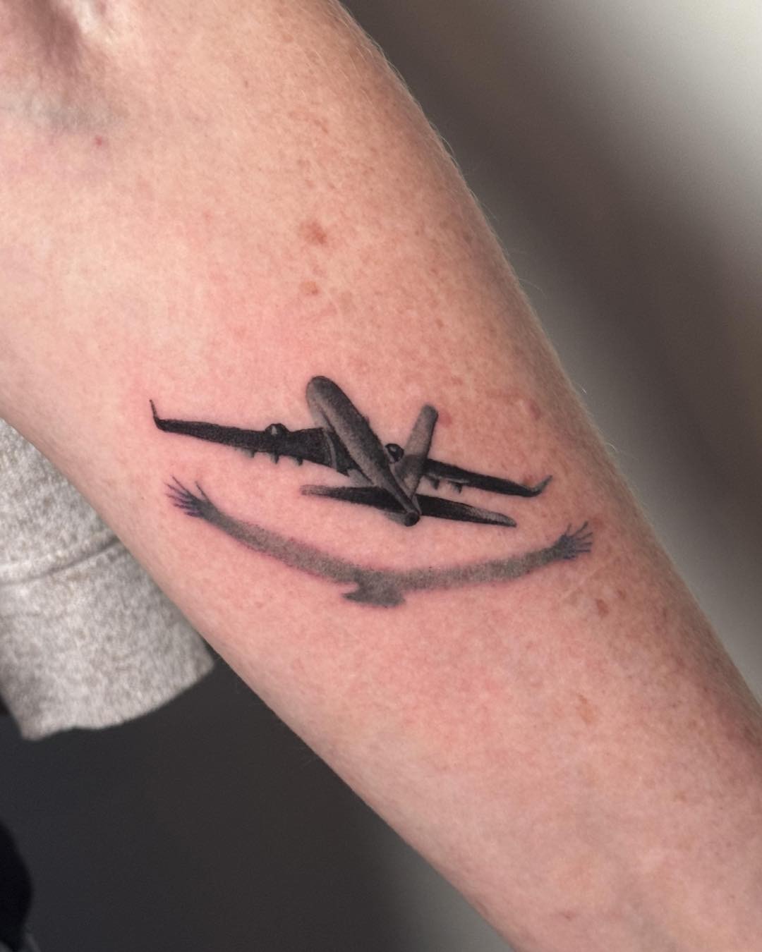 A poignant tribute with an airplane design. Tattoo Design