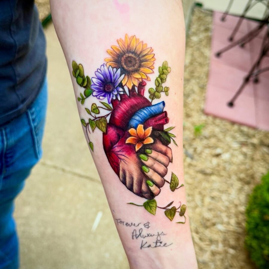 A vibrant tribute tattoo with floral elements Tattoo Design