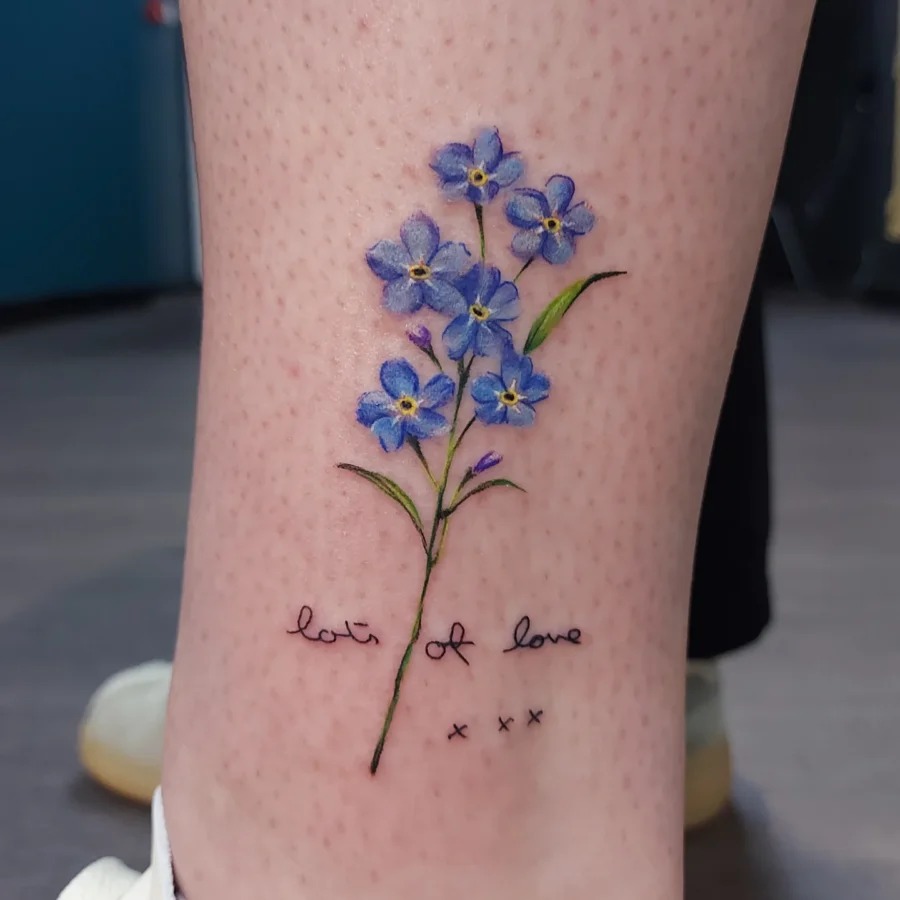 Elegant forget-me-not floral tattoo with sentiment Tattoo Design