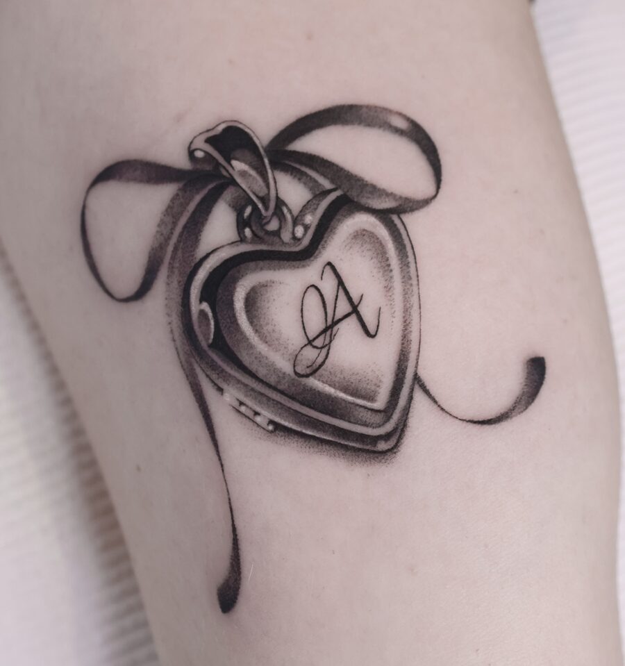 Elegant heart locket tattoo symbolizing cherished memories Tattoo Design