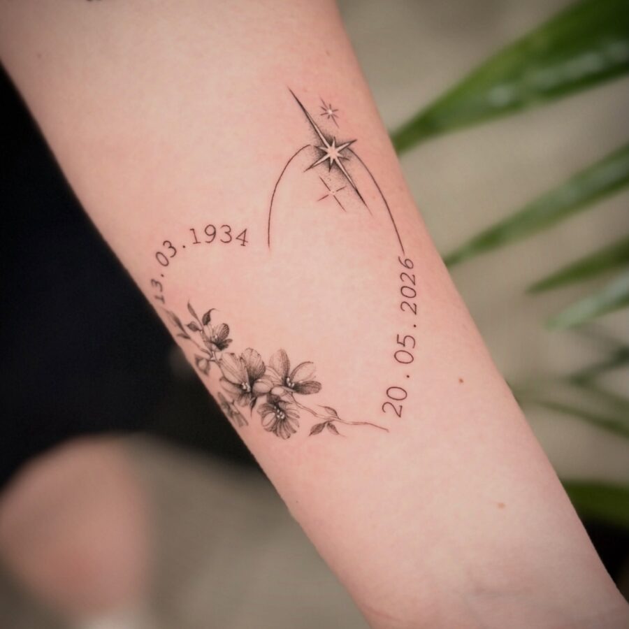 Elegant memorial tattoo with flowers and dates Tattoo Design