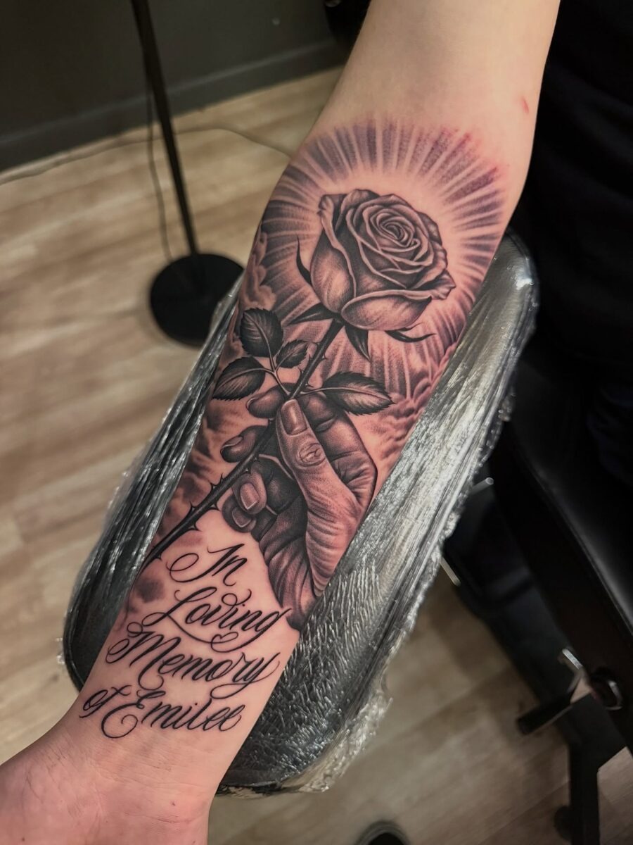 Elegant rose tattoo with heartfelt tribute lettering Tattoo Design