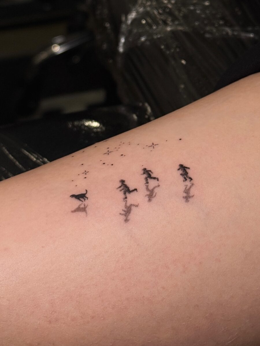 Elegant Tattoo of Running Figures with Stars Tattoo Design