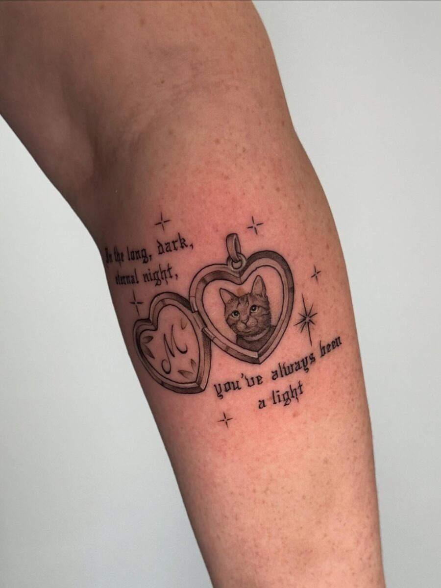 Heartfelt tribute tattoo featuring a beloved cat Tattoo Design