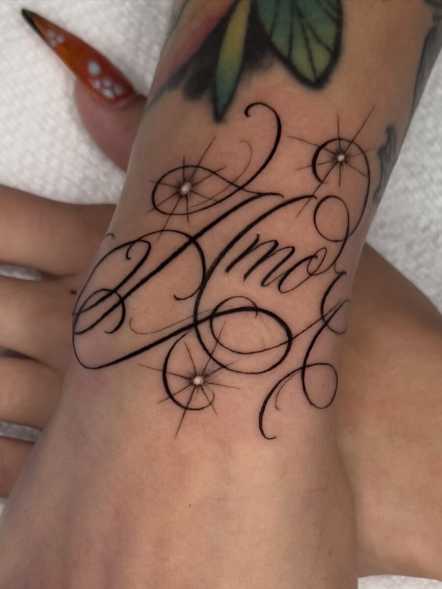 Intricate script design featuring the word ‘Amor’ Tattoo Design