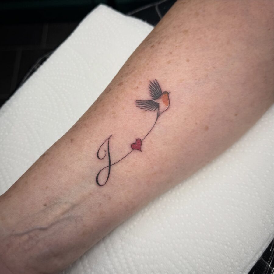 Symbolic bird and heart in memory tattoo Tattoo Design