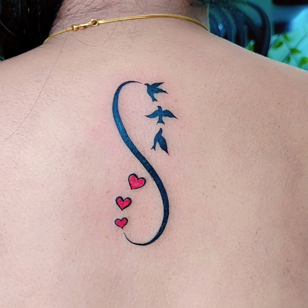 Elegant infinity design with birds and hearts Tattoo Design