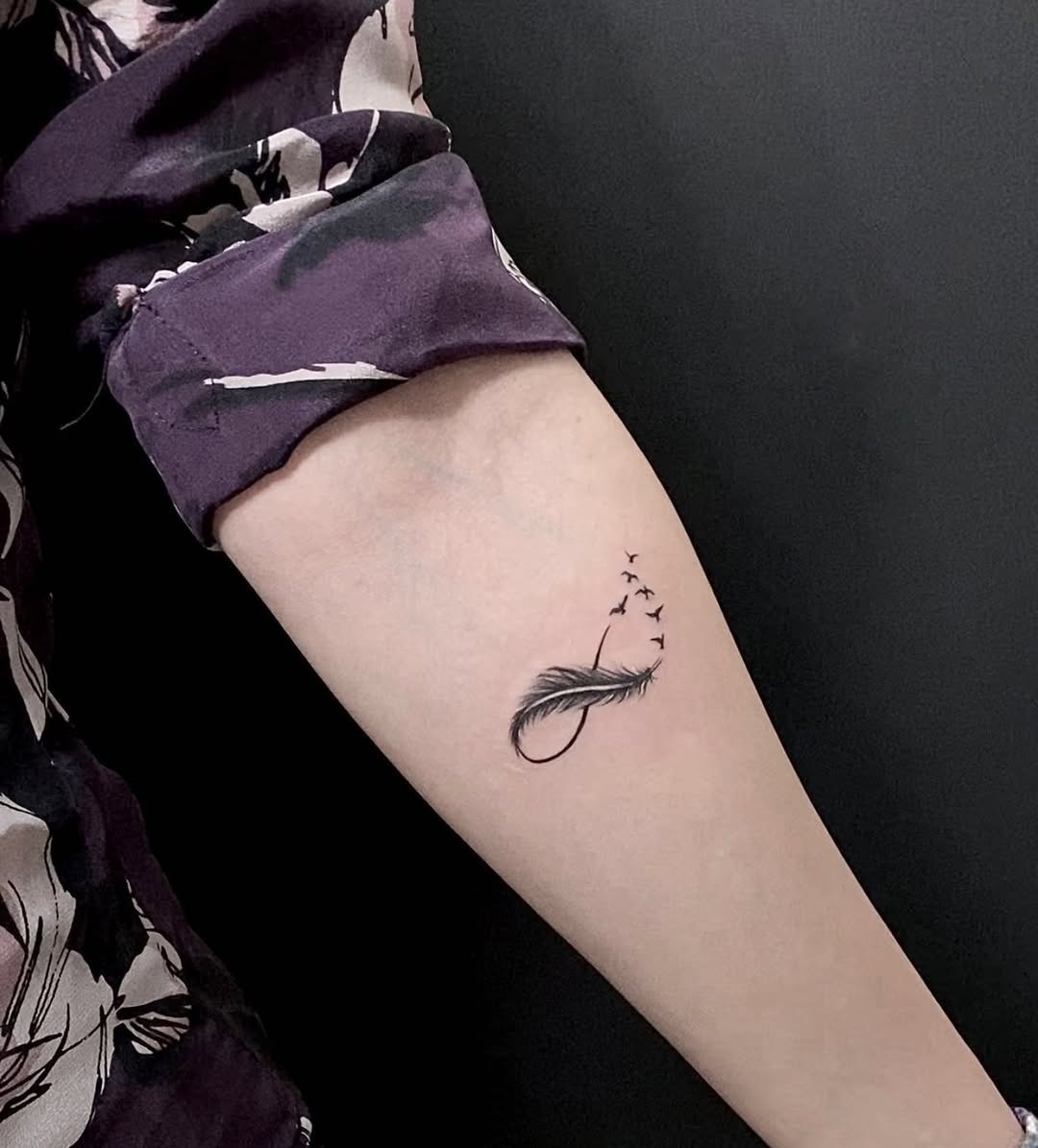 Elegant infinity feather with flying birds design Tattoo Design