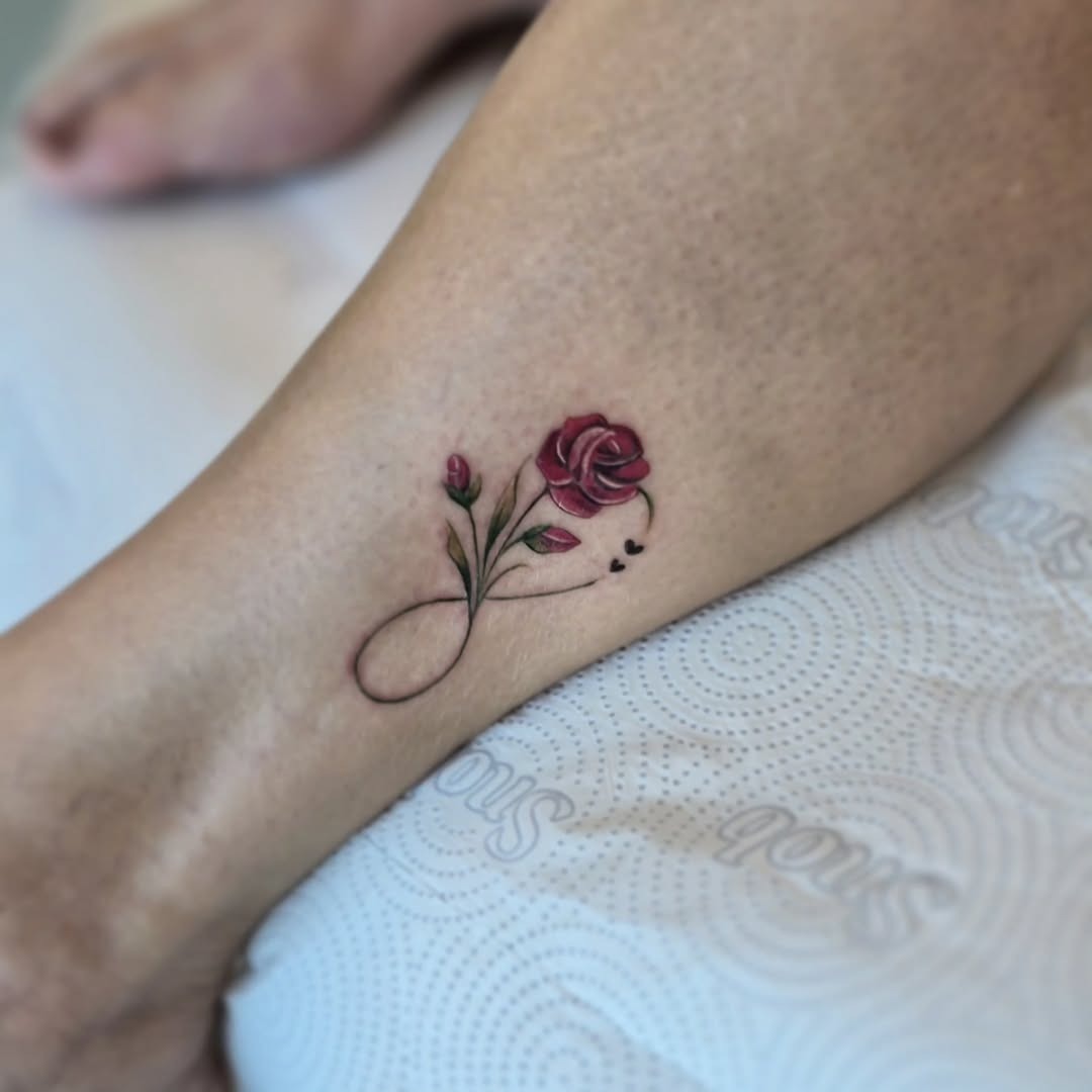Elegant infinity tattoo with sun and wave Tattoo Design