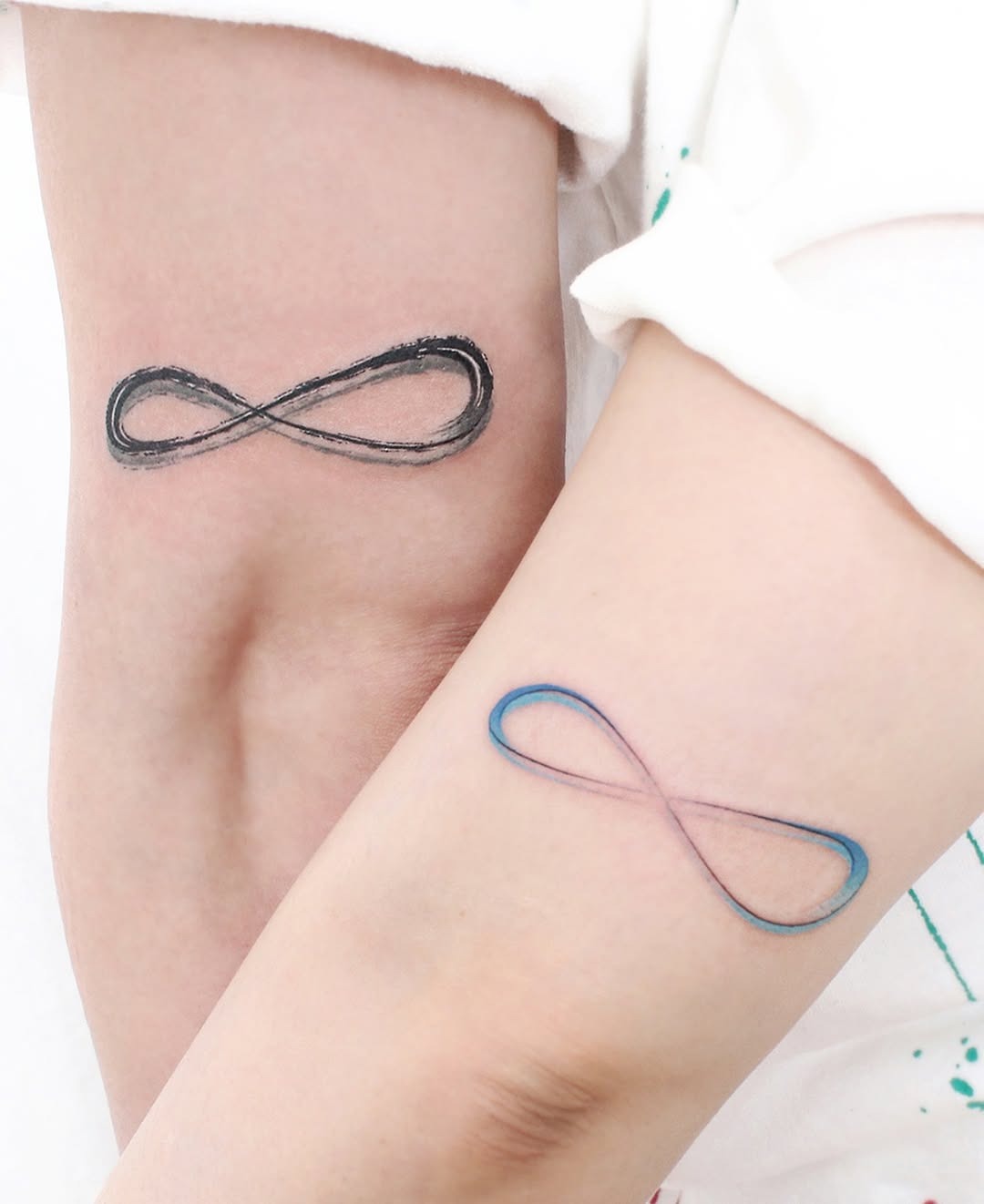 Elegant infinity tattoo with vibrant floral elements Tattoo Design