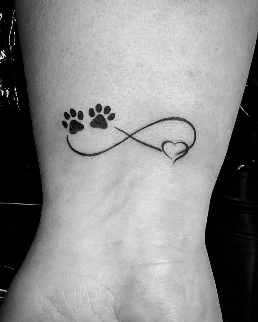 Lovely Infinity Tattoo with Paw Prints and Heart Tattoo Design