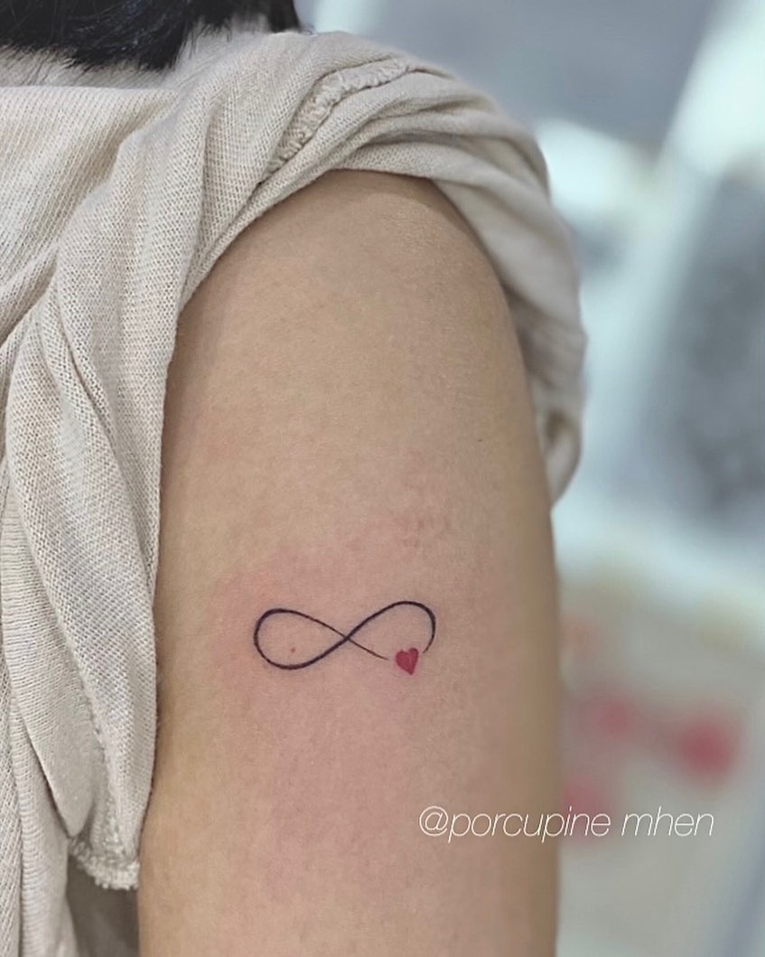 Minimalist Infinity Tattoo with a Heart Tattoo Design