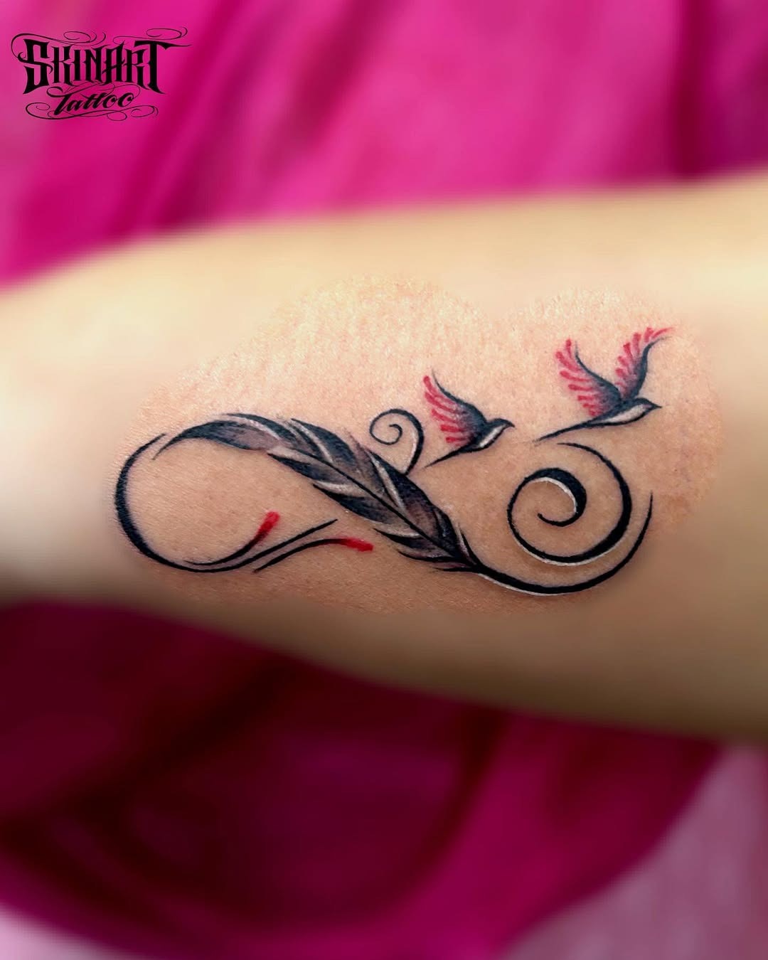 Minimalistic infinity tattoo on the forearm. Tattoo Design