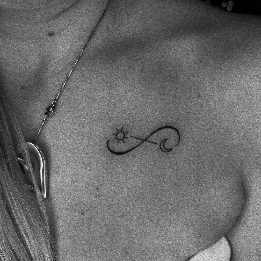 Minimalistic infinity tattoo with heart accent Tattoo Design