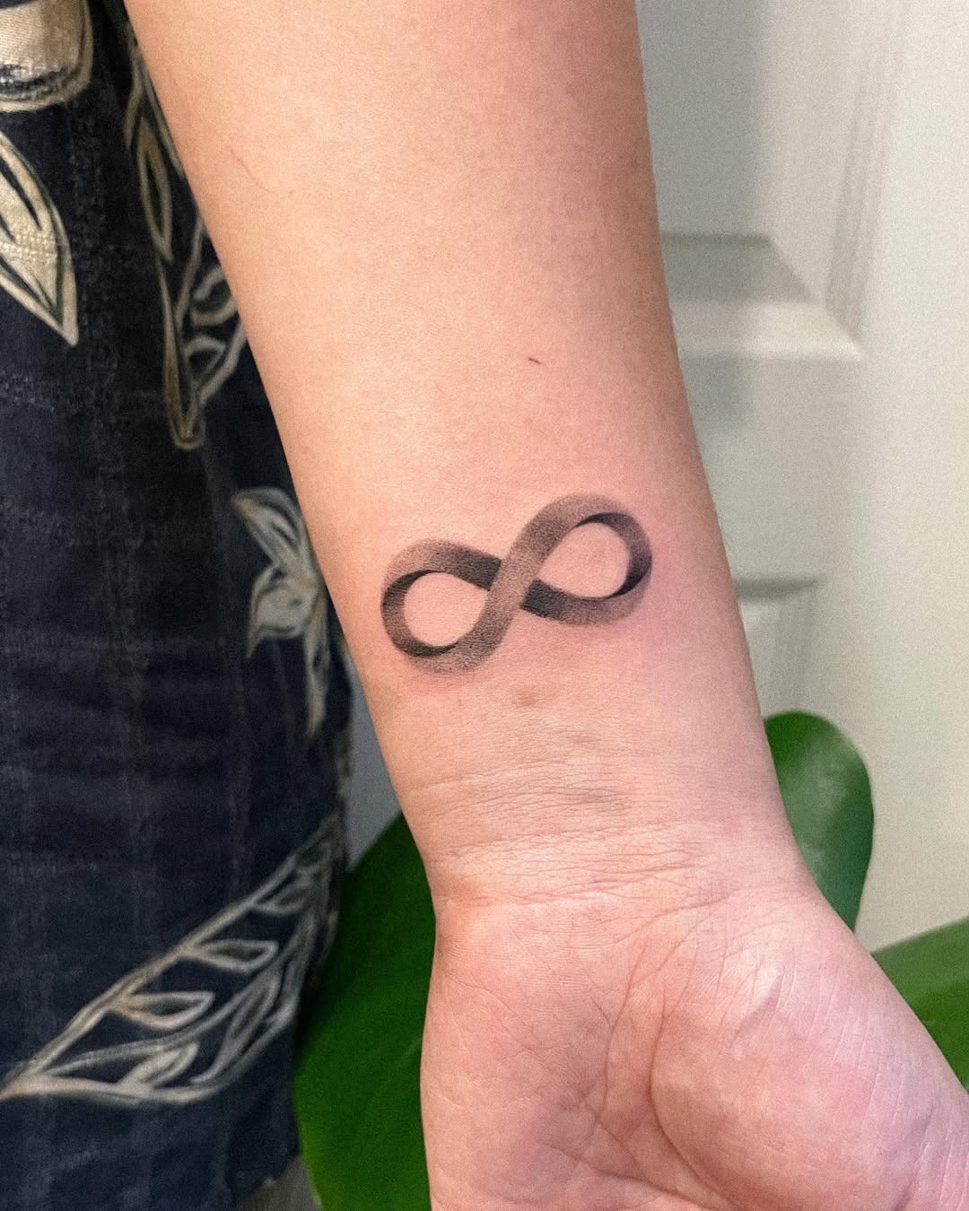 Stylish infinity tattoo with geometric elements Tattoo Design