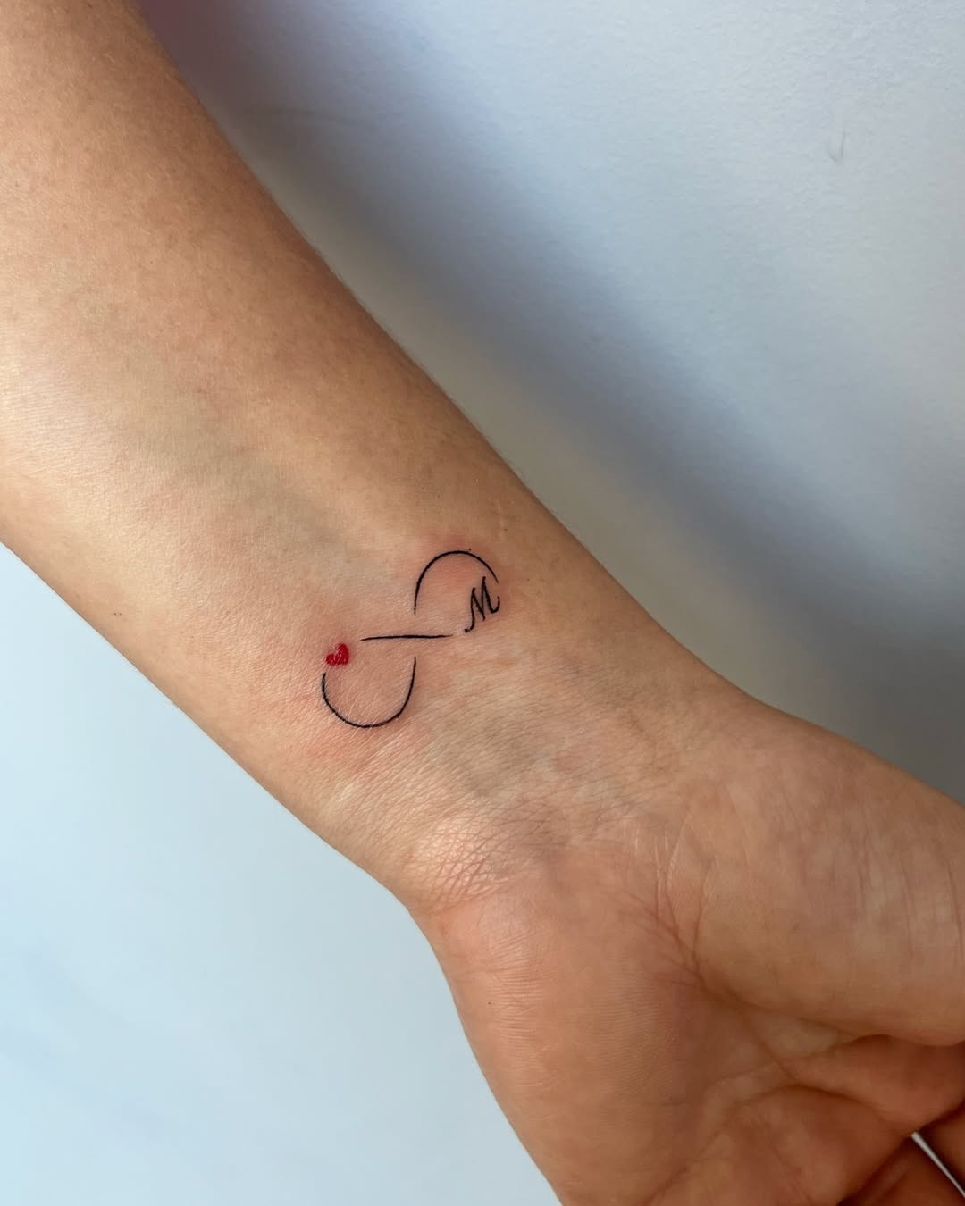 Stylish infinity tattoo with meaningful dates Tattoo Design