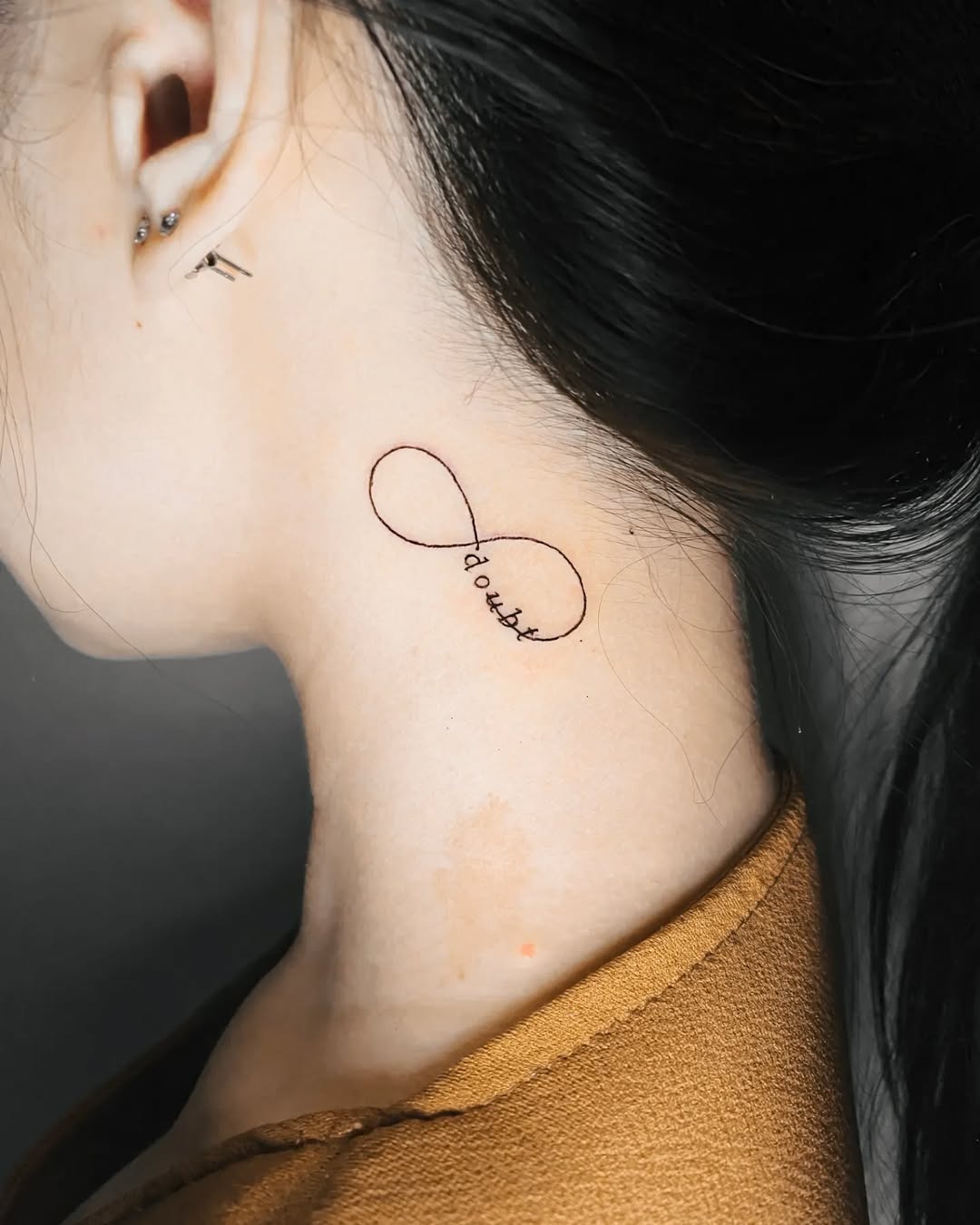 Unique infinity tattoo featuring delicate butterflies Tattoo Design