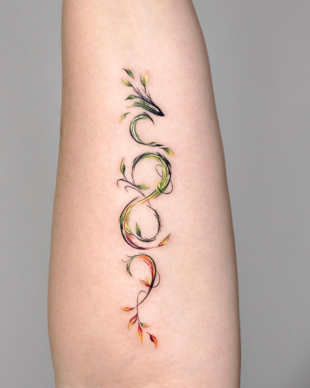Vibrant infinity tattoo with splashes of color Tattoo Design