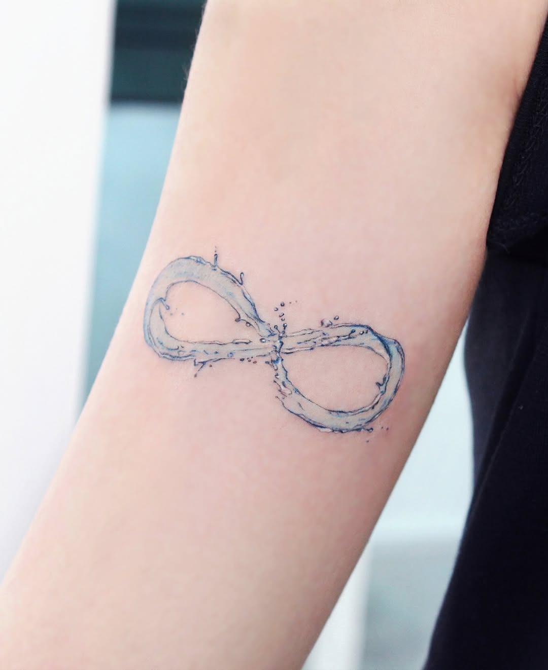Water-Inspired Infinity Tattoo on Arm Tattoo Design