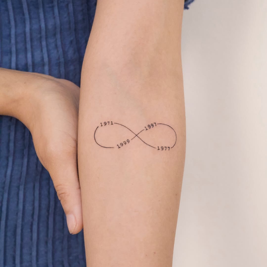 Whimsical infinity tattoo with celestial motifs Tattoo Design