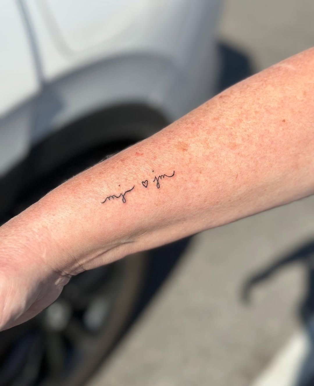 Elegant Initials Tattoo on Forearm Tattoo Design