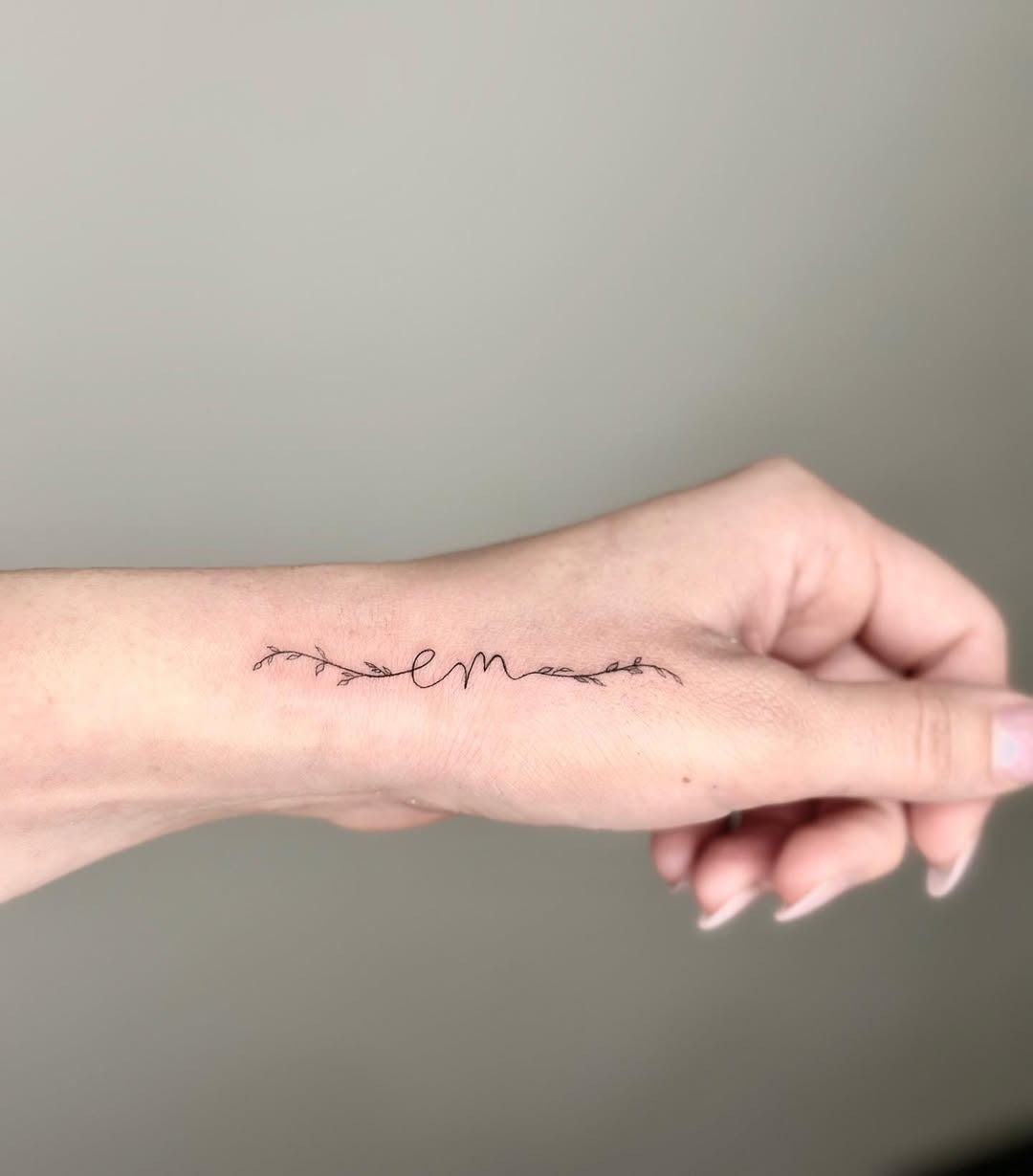Elegant Initials Tattoo with Delicate Vines Tattoo Design