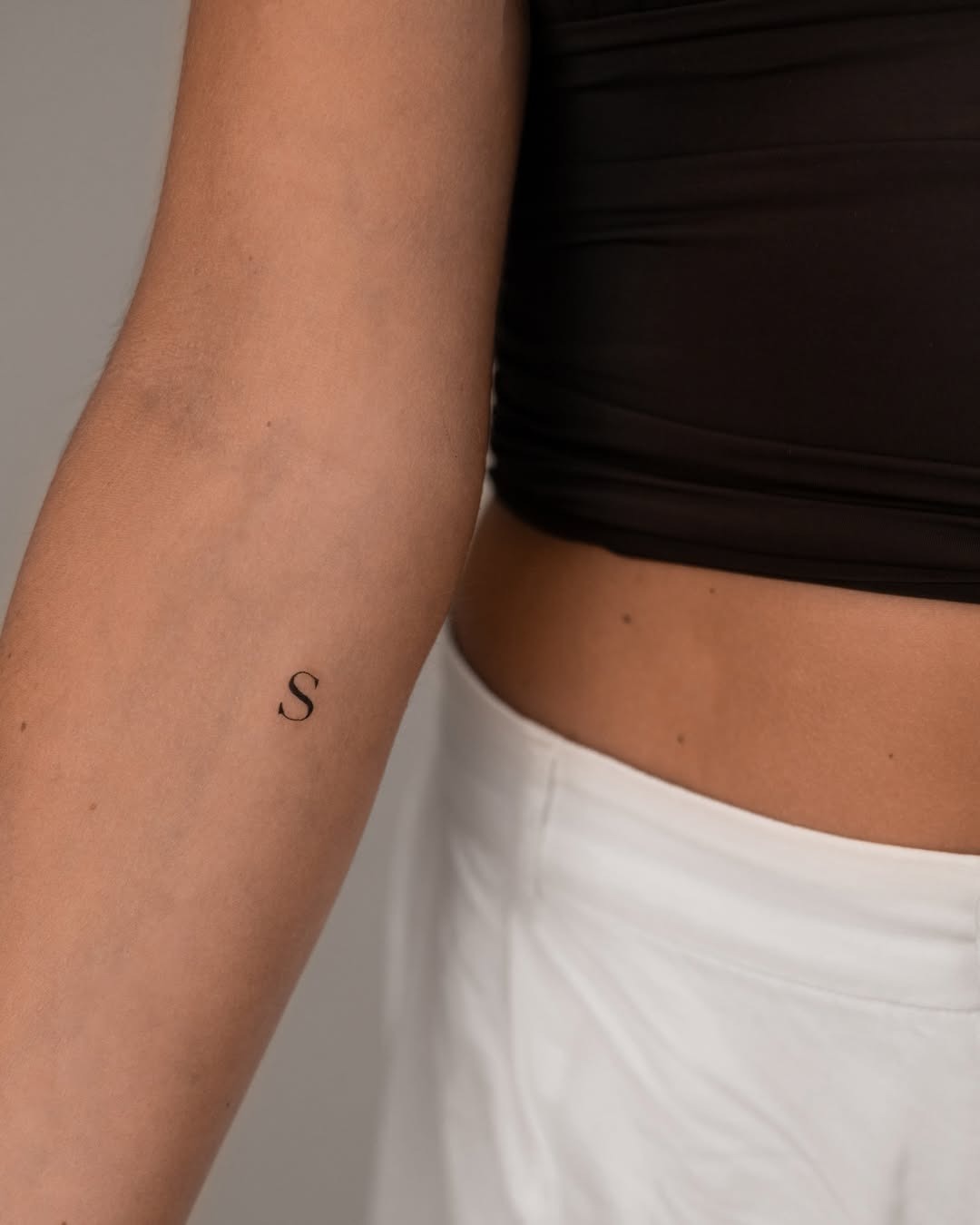 Minimalist Initials Tattoo on Arm Tattoo Design