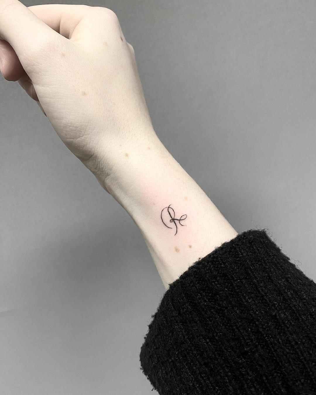 Minimalist Initials Tattoo on Wrist Tattoo Design