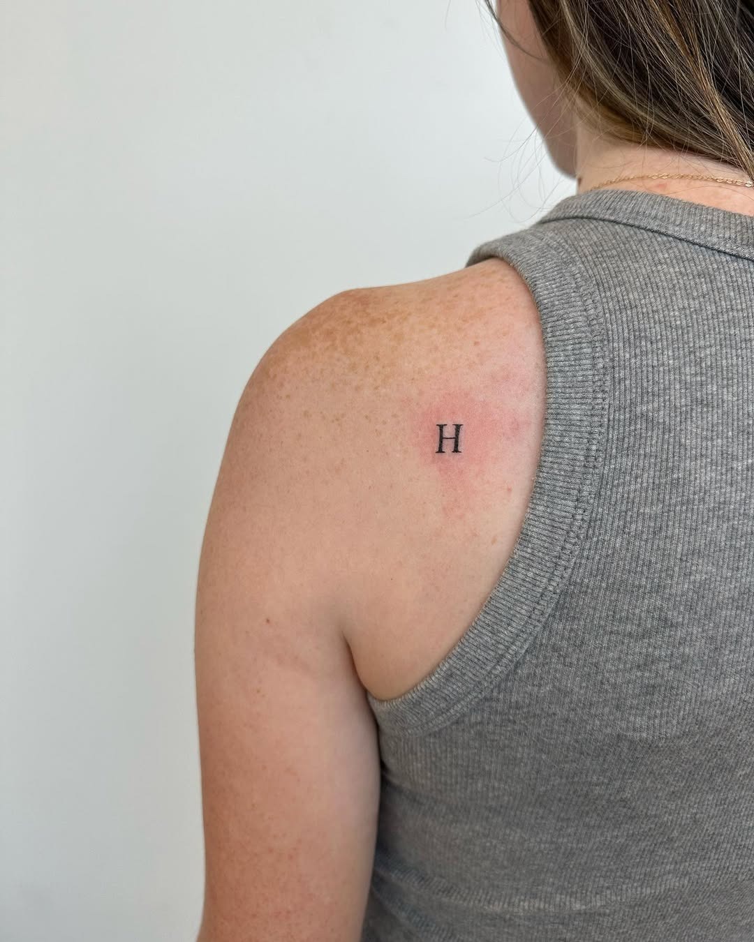 Simple Initial Tattoo on Upper Arm Tattoo Design