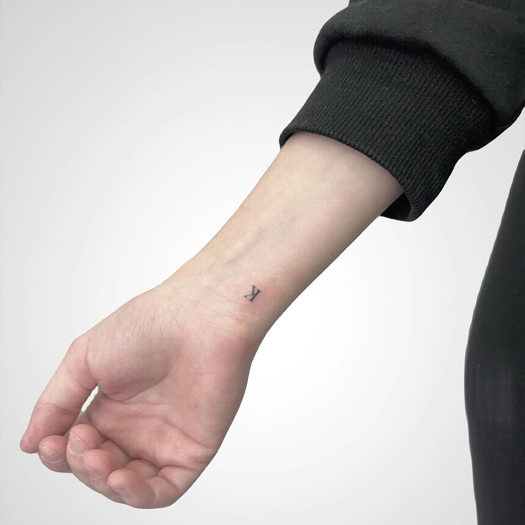 Sleek Initial Tattoo on the Wrist Tattoo Design