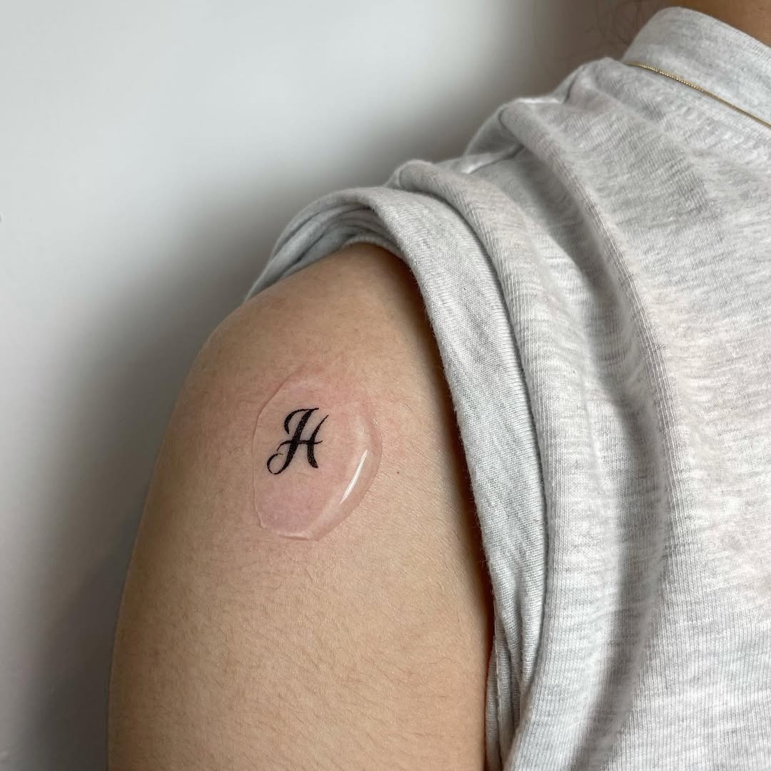Stylish H Initial Tattoo on Arm Tattoo Design