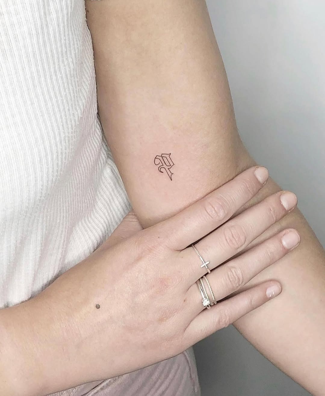 Stylish Initials Tattoo on a Woman's Arm Tattoo Design