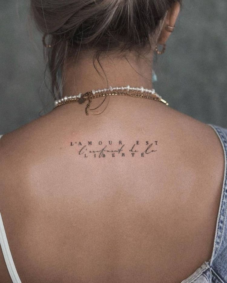 French Quote on the Spine, a tattoo design rendered in clean detailed linework for the back.