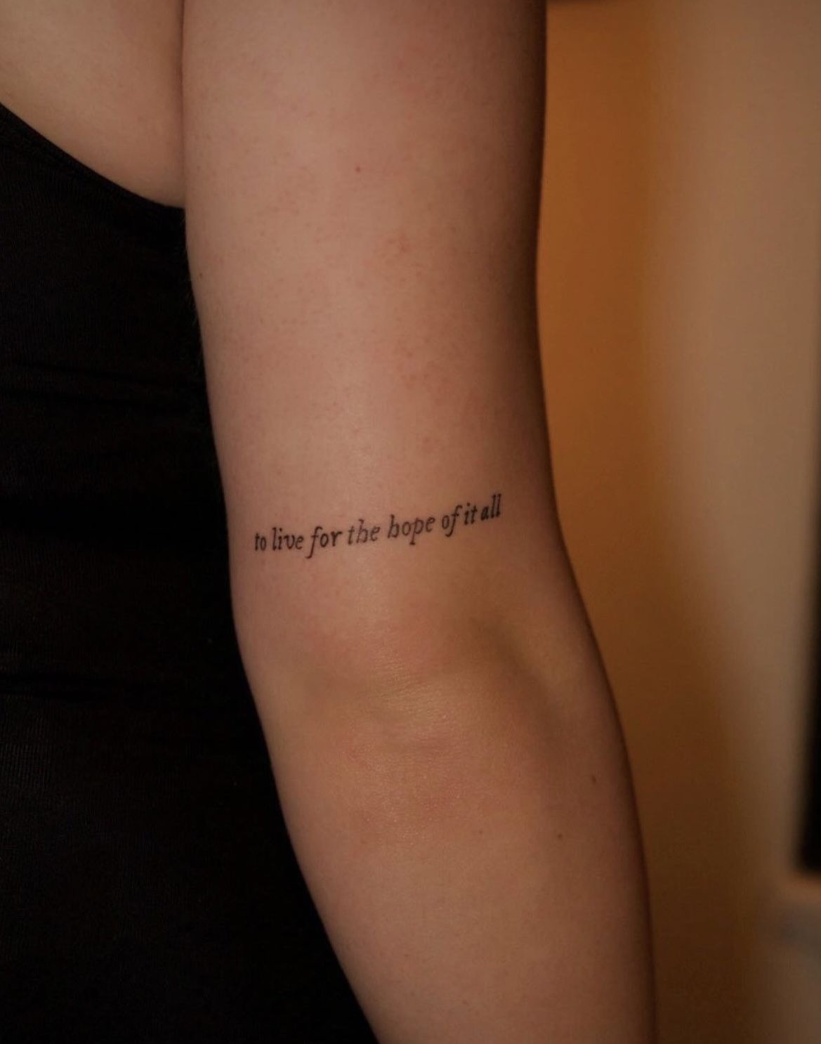 Hopeful Minimalist Quote, a tattoo design rendered in clean detailed linework for the arm.