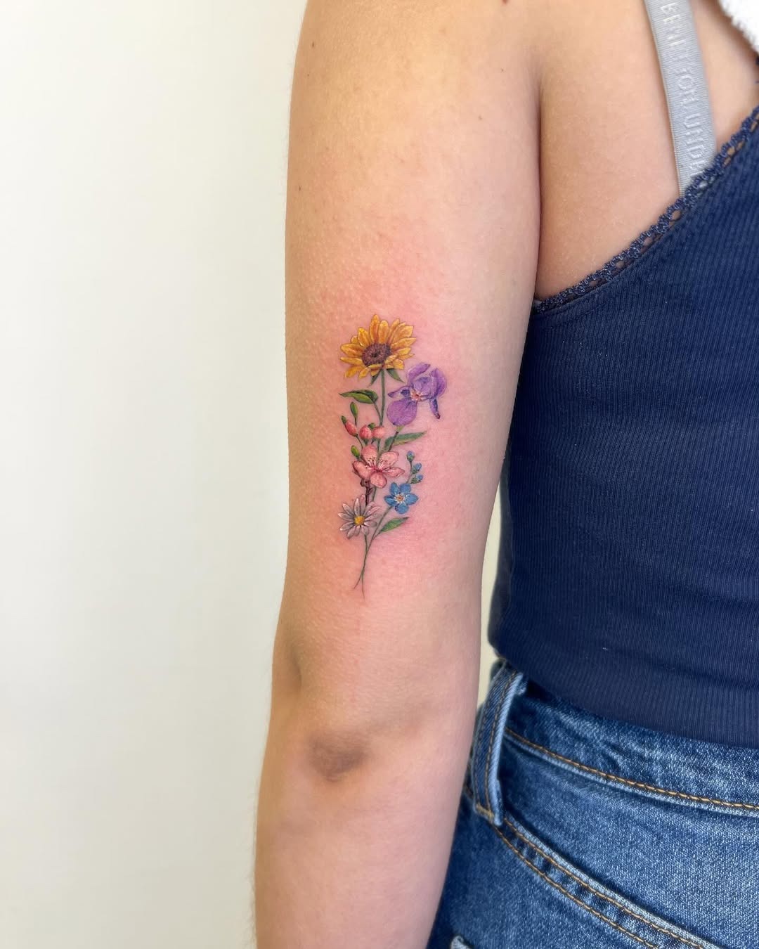 This iris tattoo showcases vivid colors and intricate designs, capturing the eye with its floral themes.