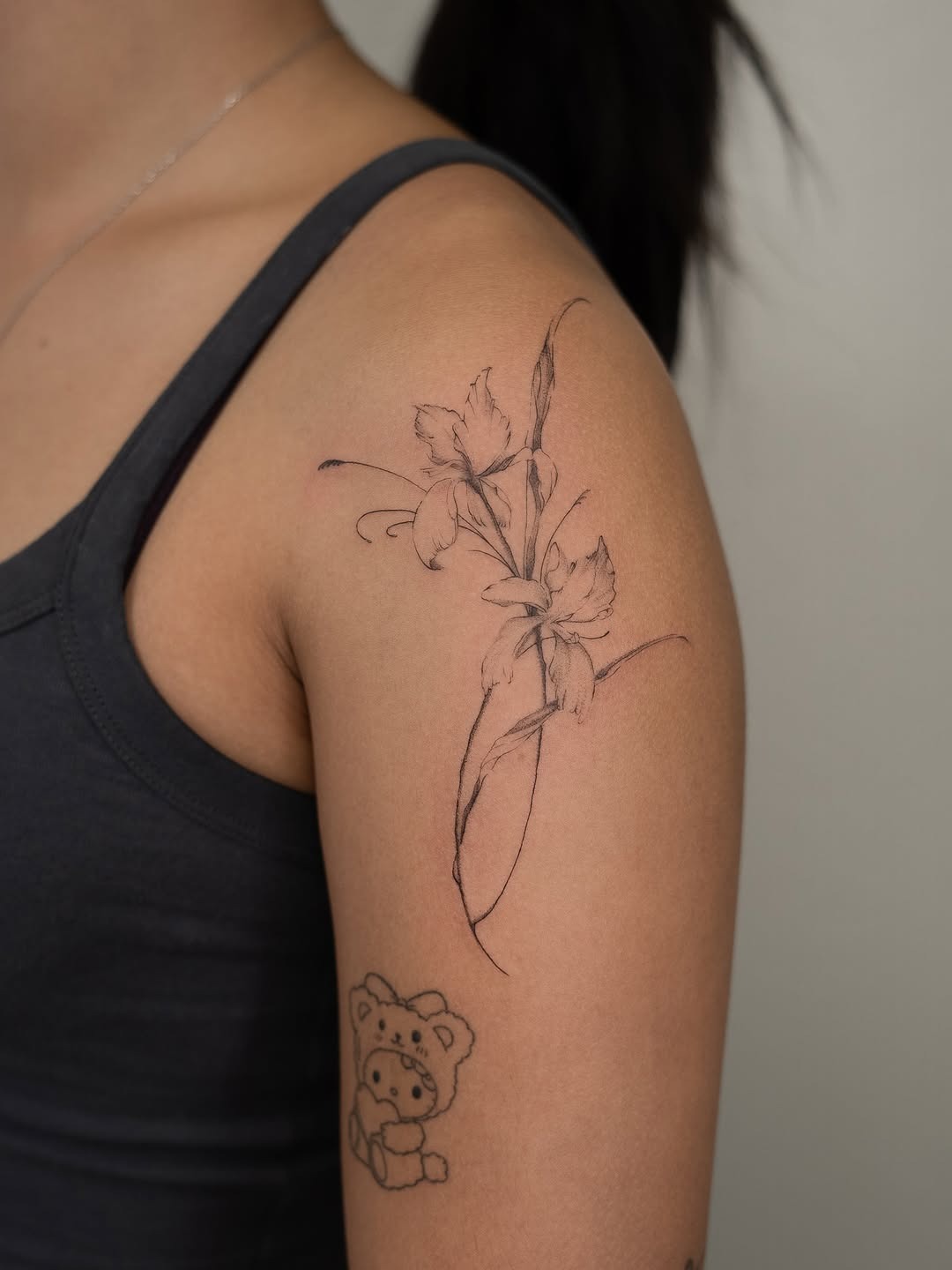This beautiful iris tattoo features delicate lines and sophisticated detailing.
