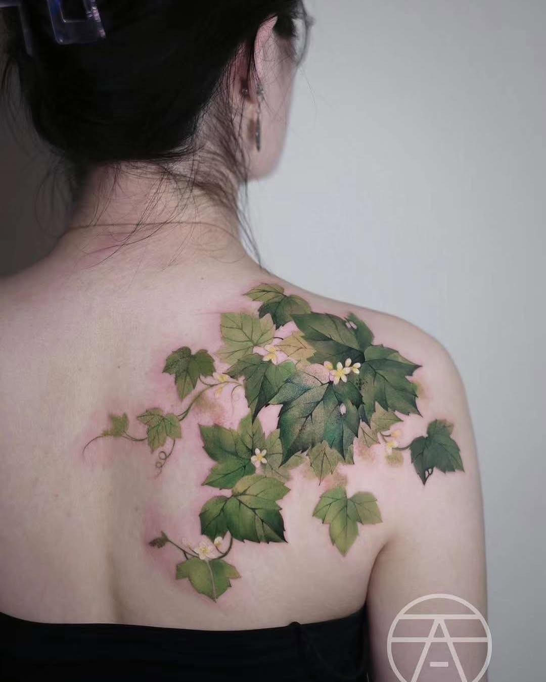 Elegant Ivy Tattoo Design on the Back Tattoo Design