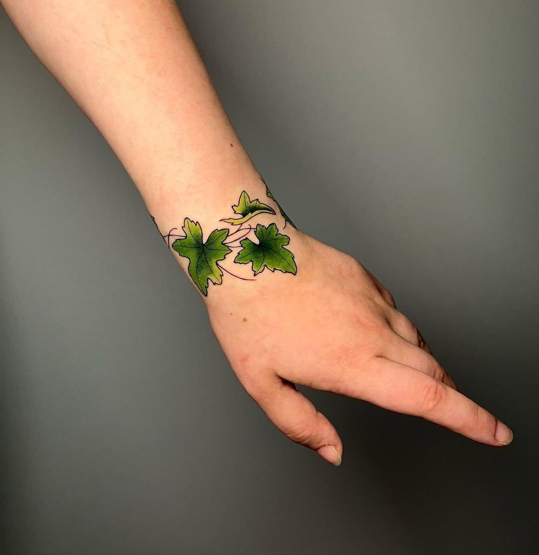 Elegant ivy tattoo encircling the wrist Tattoo Design