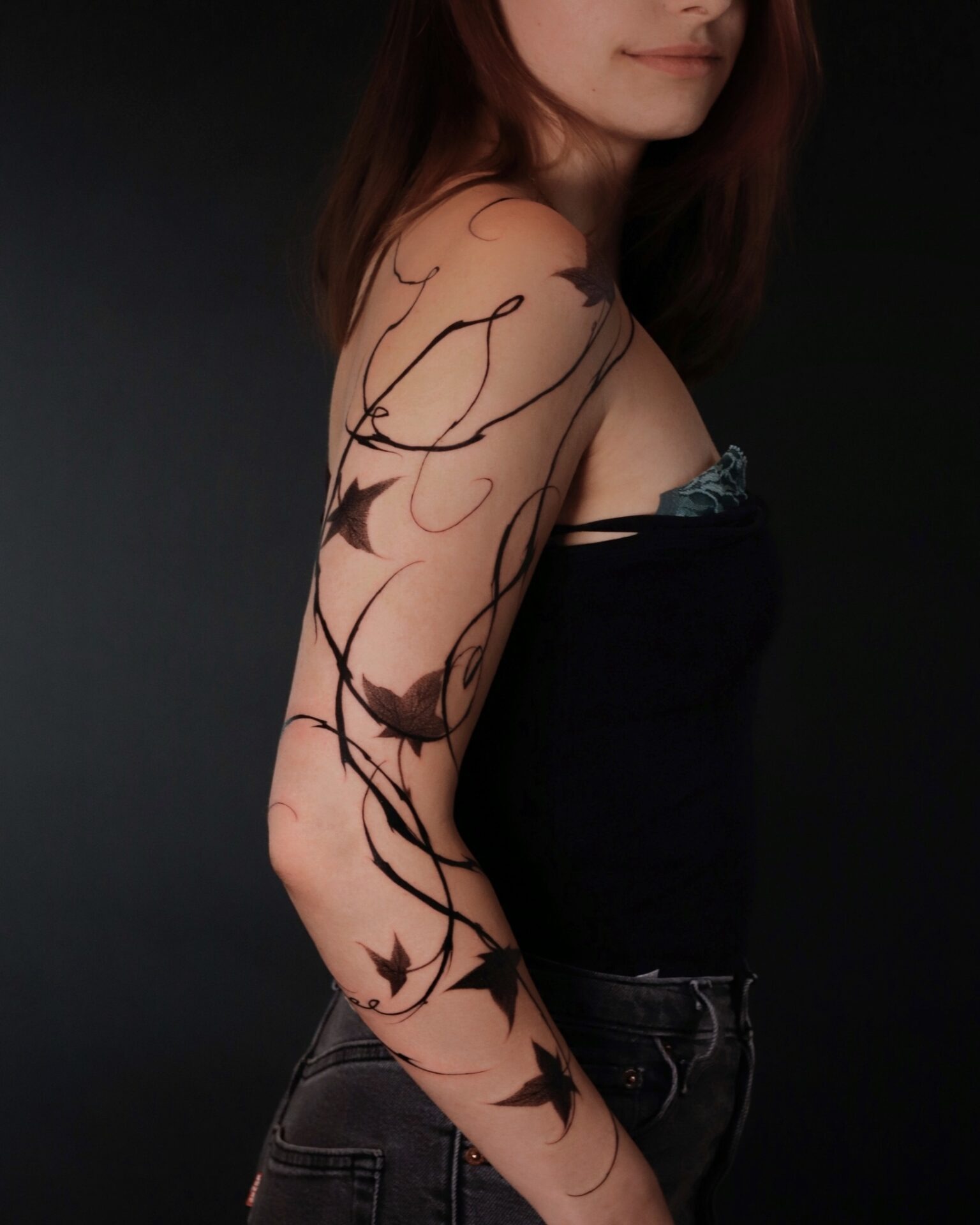 Elegant ivy tattoo enveloping the arm Tattoo Design