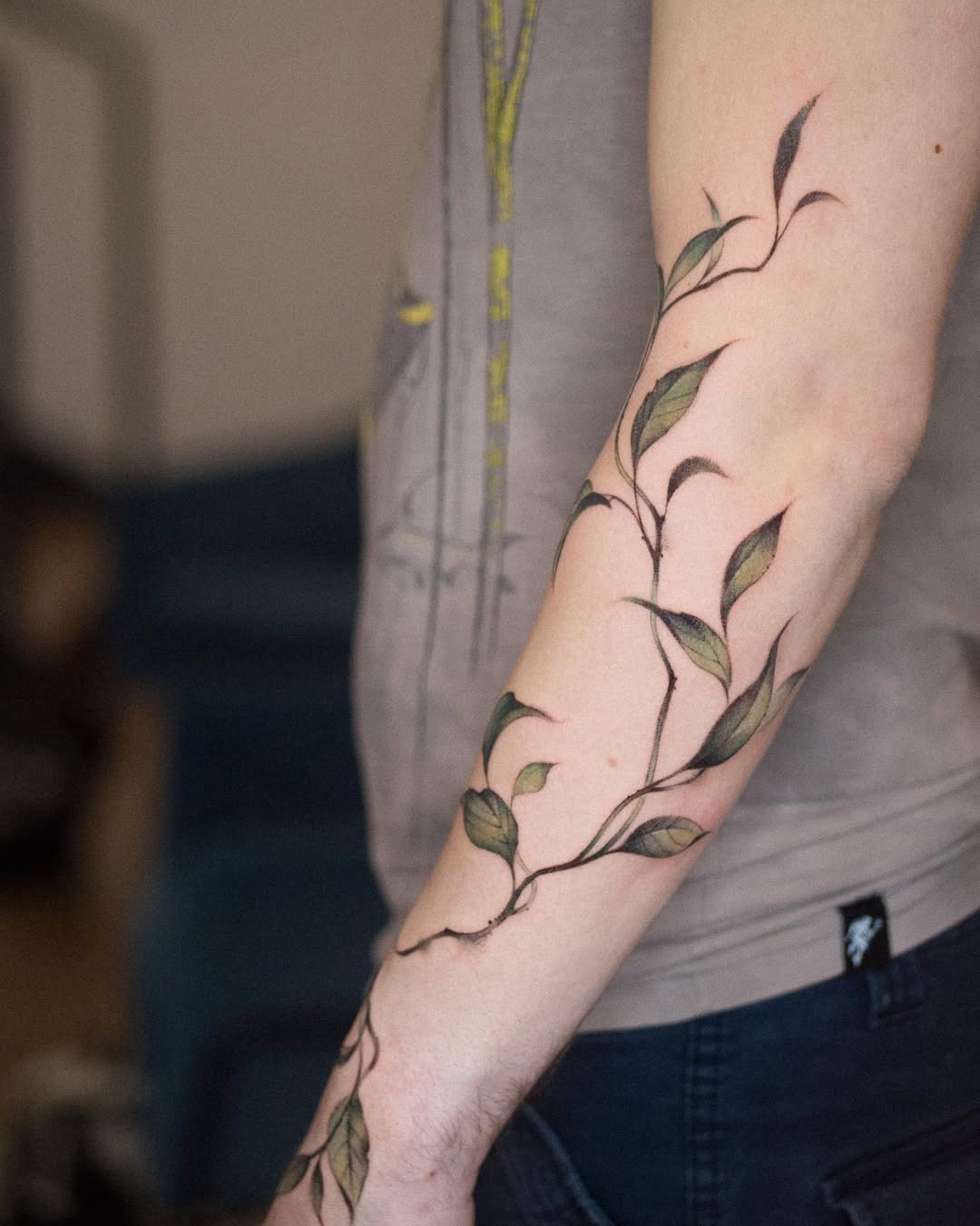 Elegant ivy tattoo winding around the forearm Tattoo Design