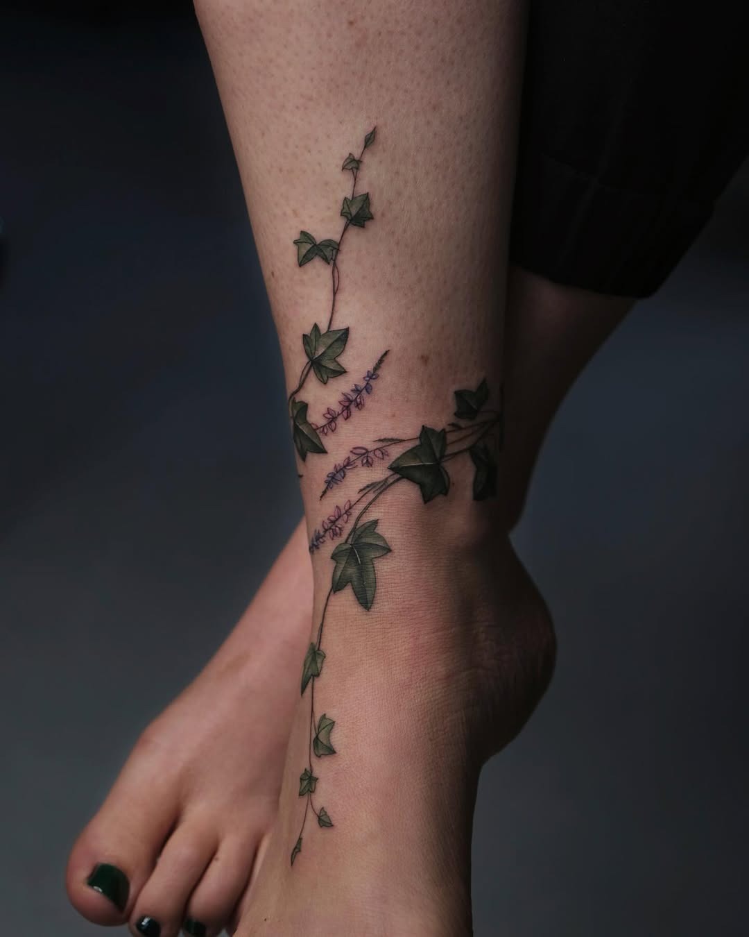 Elegant ivy tattoo wrapping around the ankle Tattoo Design