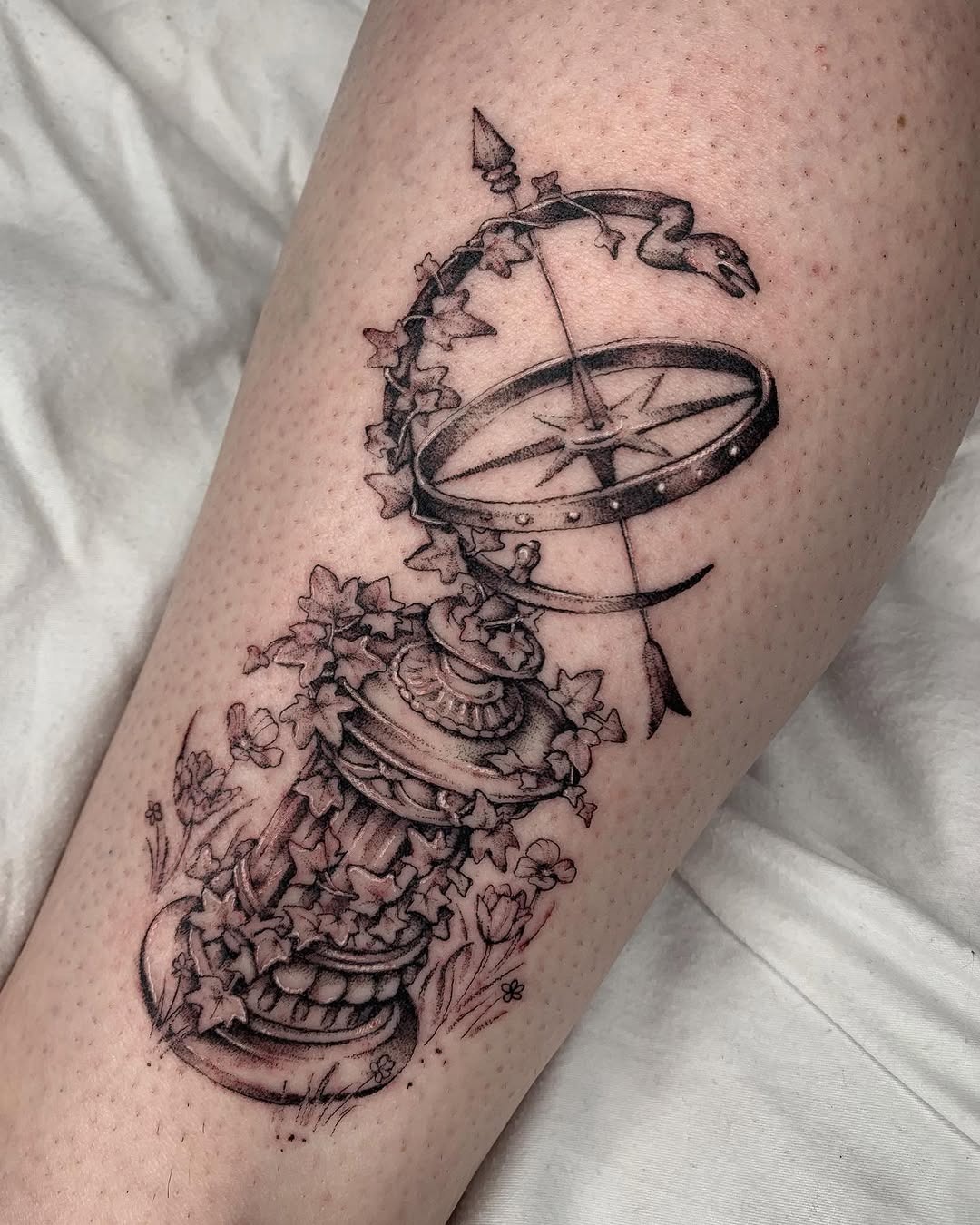 Intricate ivy tattoo entwined with a sundial Tattoo Design