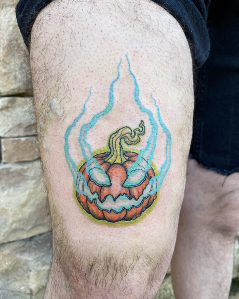 Fiery Jack O' Lantern Tattoo with Glowing Blue Flames Tattoo Design